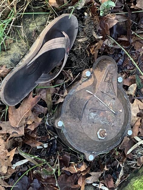 buried metal plate in front of house|metal buried in backyard.